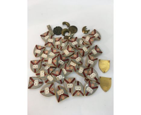 A collection of Thomas Fattorini shield shape enamel medallions, all the same design.