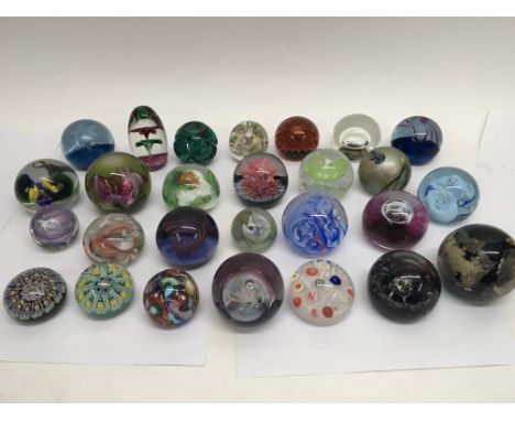 A collection of twenty seven various glass paperweights. Makers include Selkirk Glass, Caithness (including limited edition e