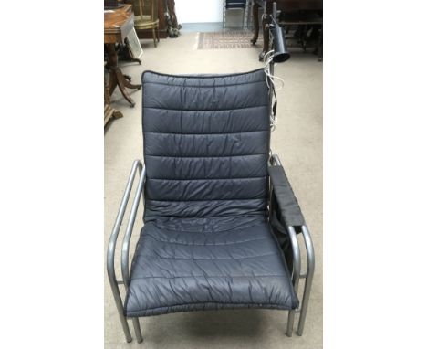 A Danish black, padded fabric, easy chair on double chrome frame with lamp attachment to one arm