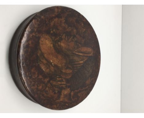 An unusual 19th century burr walnut shallow snuff box, the lid bearing a double faced woman.Approximately 9cm diameter