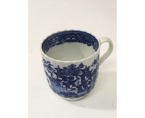 A rare 18th Century Worcester porcelain blue and white cup decorated in the Chinese style, with a shaped rim and fluted sides