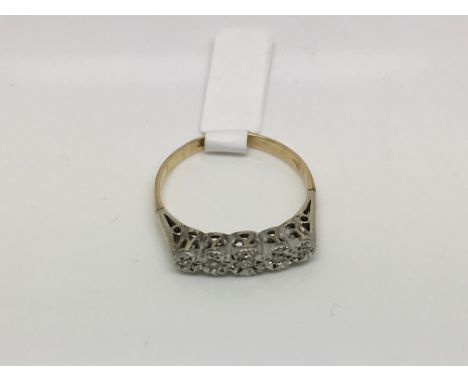 An 18ct gold and platinum five stone diamond ring, approx size O-P and approx 2.5g.