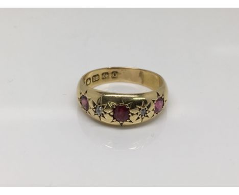 An 18ct gold ruby and diamond ring, approx size L-M and approx 2.6g.