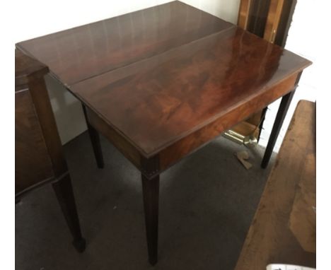 A mahogany card table with flame top.Approximately 91x91x71cm