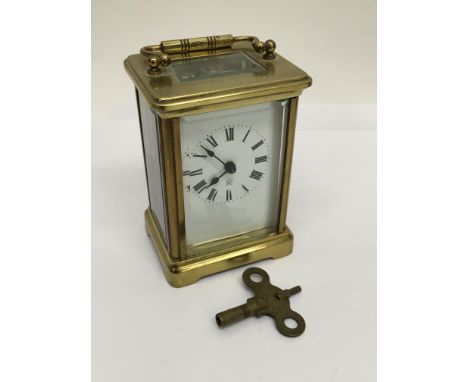 A brass cased French carriage clock.