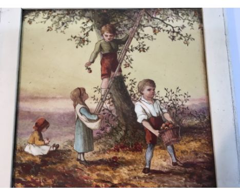 A Victorian square porcelain tile depicting children picking apples,