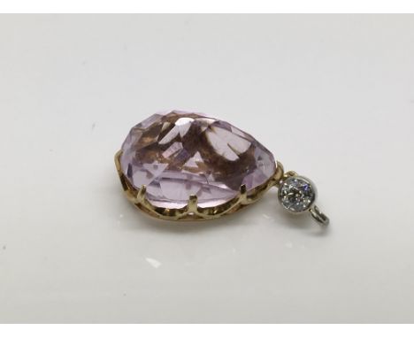 A gold, amethyst and diamond ring drop pendant.