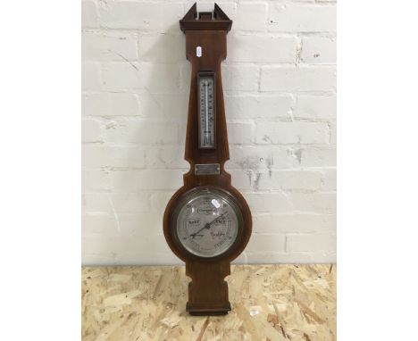 A wooden barometer.