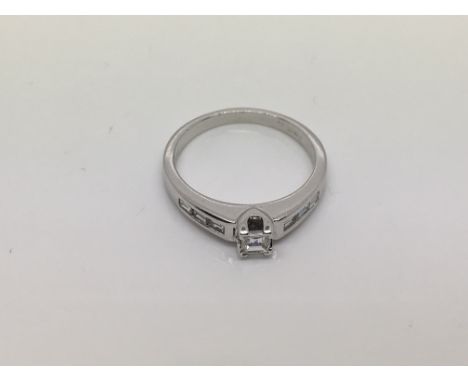 An 18ct white gold princess cut solitaire diamond ring, approx size L-M and 4g.