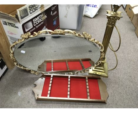 A brass table lamp, wall mirror and a wooden display rack (3).