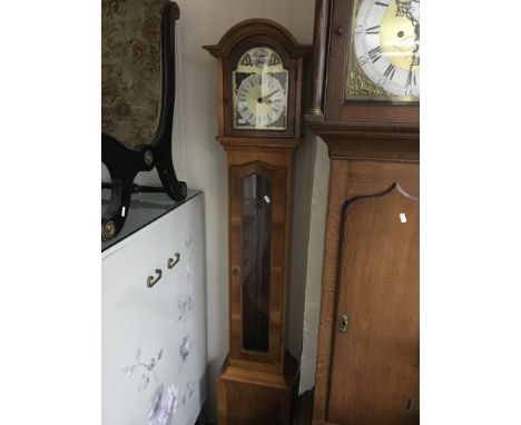 A modern yew wood long case clock.