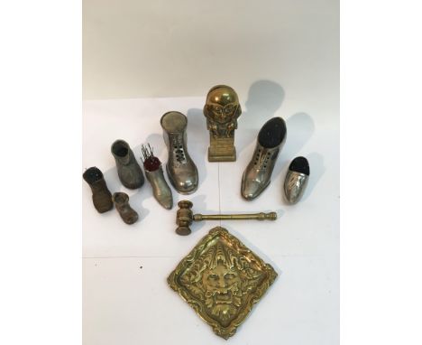 A small group of shoe pin cushions, brass gavel and lion tray