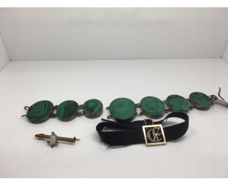 An Edwardian broach inset with opal a malachite bracelet and a black band with attached seed pearls ,