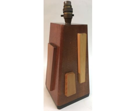 An unusual modern design wooden lamp, of triangular block shape with applied contrasting decoration.Approximately 28cm high