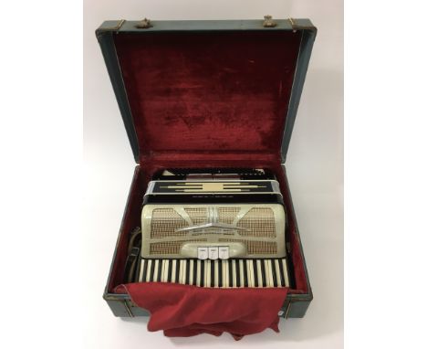 A cased ladies Ferrari accordion.