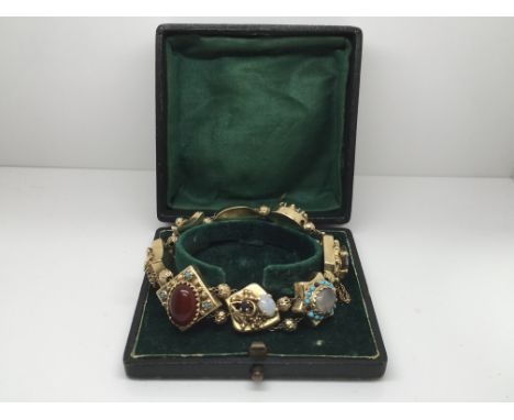 A boxed fine quality Victorian 14ct yellow gold slide bracelet, circa 1890, set with various gem stones, approx 47.7g.