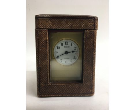 A brass carriage clock by Brooke & Son, Edinburgh.