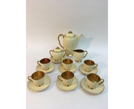 An Art Deco Carltonware coffee set of cream and gold design