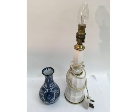 A Danish white glazed lamp base and blue painted art pottery vase