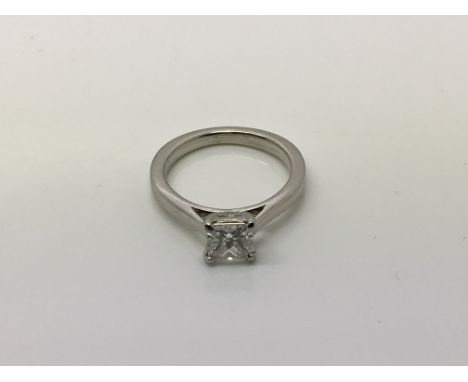 A platinum diamond engagement ring with a central princess cut diamond, approx 0.90ct, colour E, VVS2 clarity, approx size I 