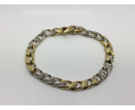 An 18ct white and yellow gold diamond bracelet, approx length 20cm.