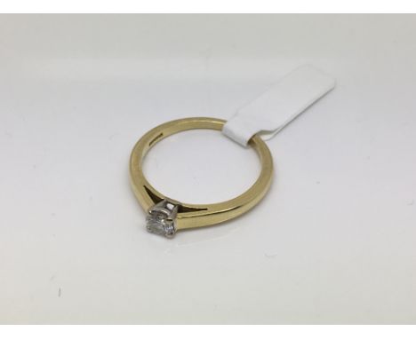 An 18ct yellow and white gold solitaire diamond ring, approx 1/3ct, size T and approx 4.4g.