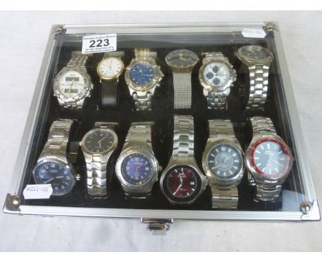 Twelve gents Quartz Wristwatches with Display case to include Casio Oceanus, Sekonda, Accurist, etc