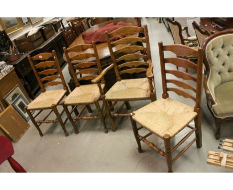 Set of Four Oak Ladder Back Dining Chairs with String Seats (includes one carver)