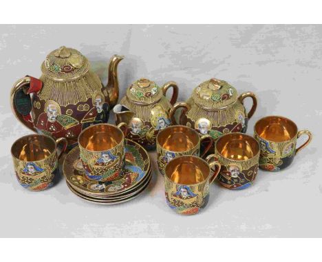 Japanese Coffee Service decorated with faces of immortals comprising Coffee pot, Milk Sugar, Six Coffee Cups and Saucers mark