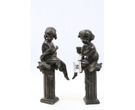 Pair of Bronze Figures of Classical Children sat on Plinths