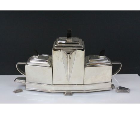 Art Deco Style White Metal Three Piece Tea Service comprising Teapot, Milk and Sugar fitted onto a Geometric Shaped Serving T