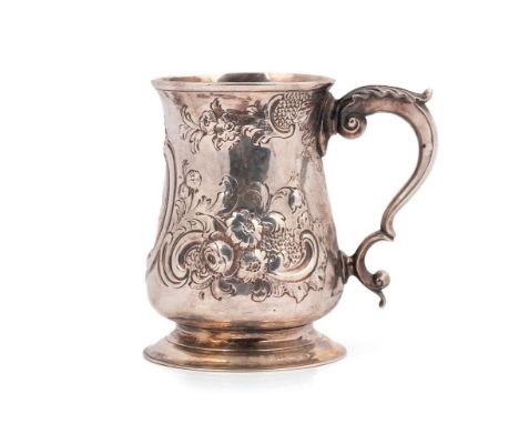 George II silver tankard, repousse chase flower and leaf decoration, double scroll handle with acanthus leaf thumb piece, New