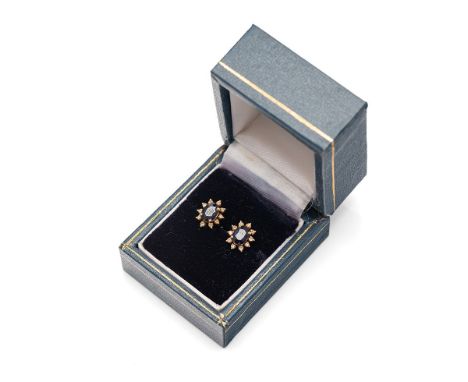 A pair of 14ct gold, sapphire and diamond earrings, of flowerhead form, set with central oval cut sapphire of approximately 6