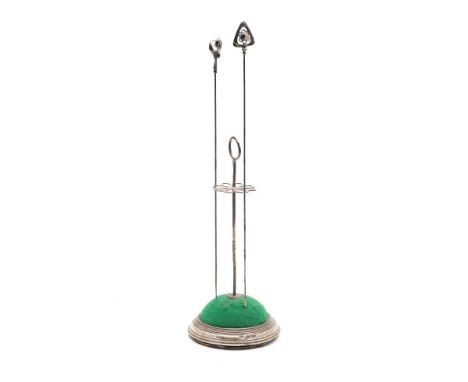 A silver hat pin stand, hallmarked Birmingham 1931 together with two Chester hallmarked Charles Horner silver hat pins, (3).