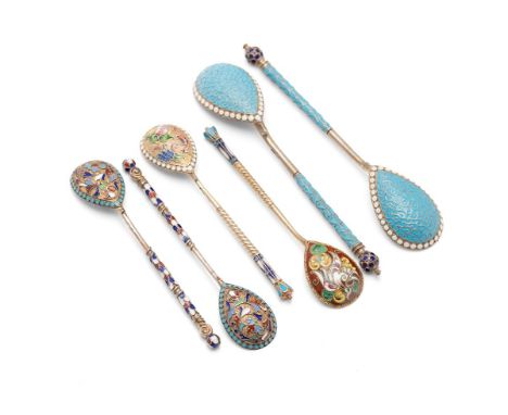 Two pairs and one near pair of Russian late 19th and early 20th century silver, silver gilt and cloisonne spoons, the larger 