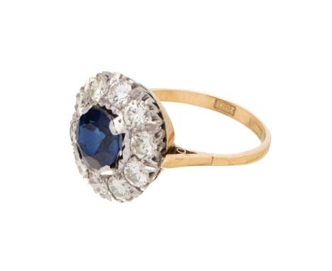 An Art Deco 18ct gold, platinum, sapphire and diamond dress ring, the central deep royal blue sapphire of approximately 8.1mm