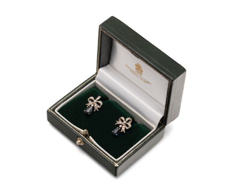 A pair of 18ct white gold, diamond and sapphire drop earrings, the diamond set three looped bow form with pear cut sapphire d