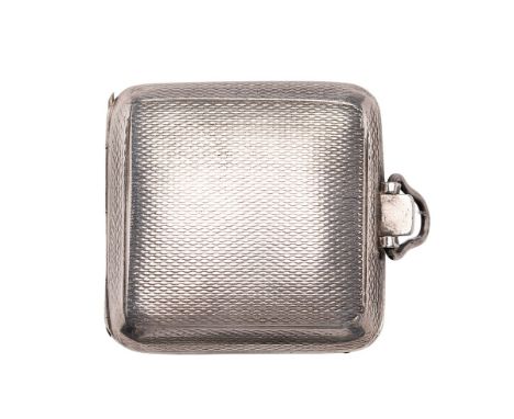 A silver Art Deco travelling watch / clock, engine turned case, Arabic numerals, 4cm wide.  winds sets and runs intermittentl