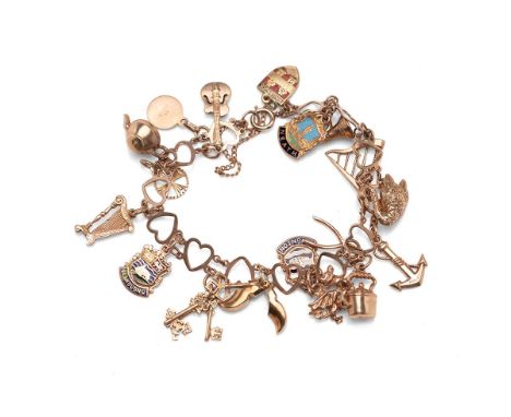 A delicate heart shaped link charm bracelet with seventeen 9ct gold charms 20.0g, and an additional 15ct gold charm 1.3g.