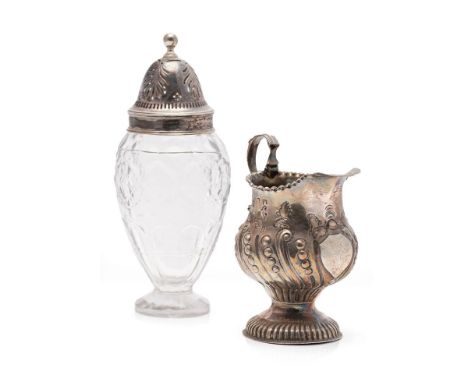A George III silver cream jug, hallmarks rubbed though probably London 1764, swirling decoration, lion armorial to front, wit