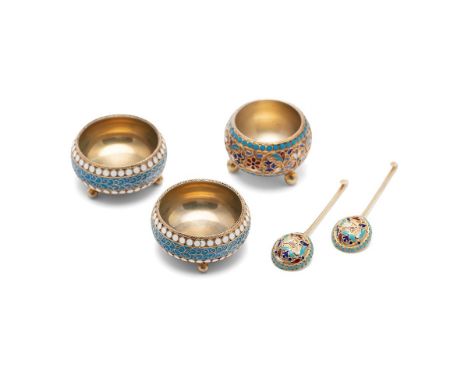A pair of 19th or early 20th century Russian silver and silver gilt and cloisonne salts, with spoons,  first Kokoshnik mark f