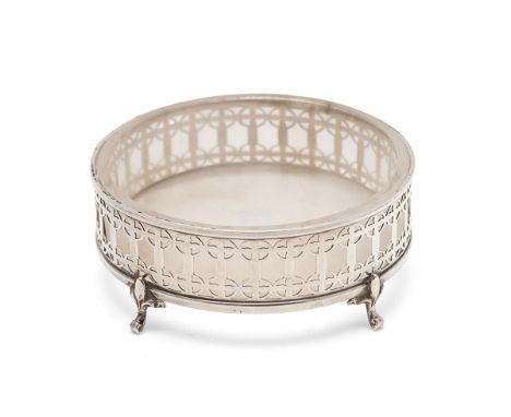 Silver and glass butter dish with pierced design, silver weight 38.1g, raised on four fleur-de-lys legs, 9.5cm diameter.  Goo