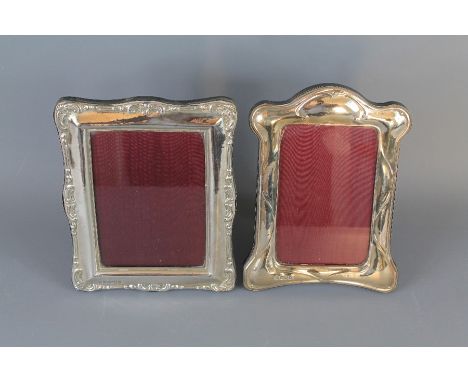 Two Silver Photo Frames. The first frame London hallmark, with Britannia standard, mm Paul Vernon Fitchie, maroon moire silk 