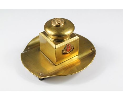 Brass HMS Corinthia Ink Well. The ink well lid is inset with a military button complete with glass liner.&nbsp;