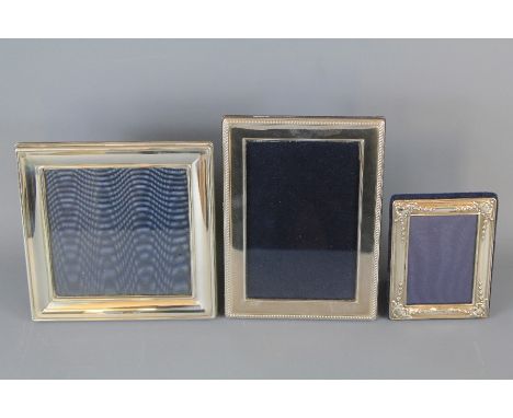 Three Silver Photo Frames. The first by Robert Carr, Sheffield hallmark, dated 2001 with easel support, approx 13 x 19 cms, t