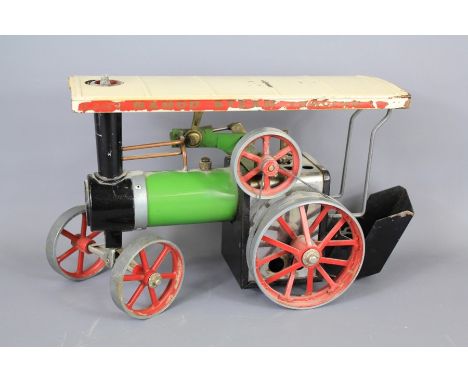 A Vintage Mamod TE1A Steam Tractor. The tractor with The engine with green enamel body and red painted wheels, approx 25 x 13