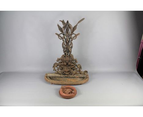 A Cast Iron Umbrella Stand. The stand modelled as water-lily (af) together with a heavy cast iron door knocker with lion mask