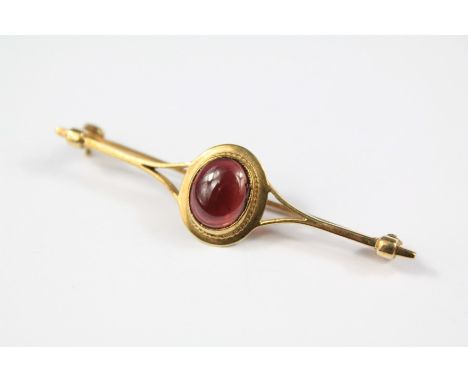 A Gentleman's Vintage 9ct Gold Cabochon Garnet Stock Pin. The stock set with a garnet approx 10 x 8 mm, approx 3.3 gms, appro