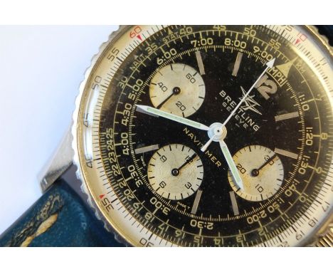 A Gentleman's Vintage Breitling Navitimer Wrist Watch. The stainless steel watch having a black face, case stamped 908, on a 