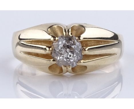 A 9ct gold solitaire diamond gypsy ring, old-cut diamond approx 0.65cts, setting height 9.1mm, size Q, 5.3g